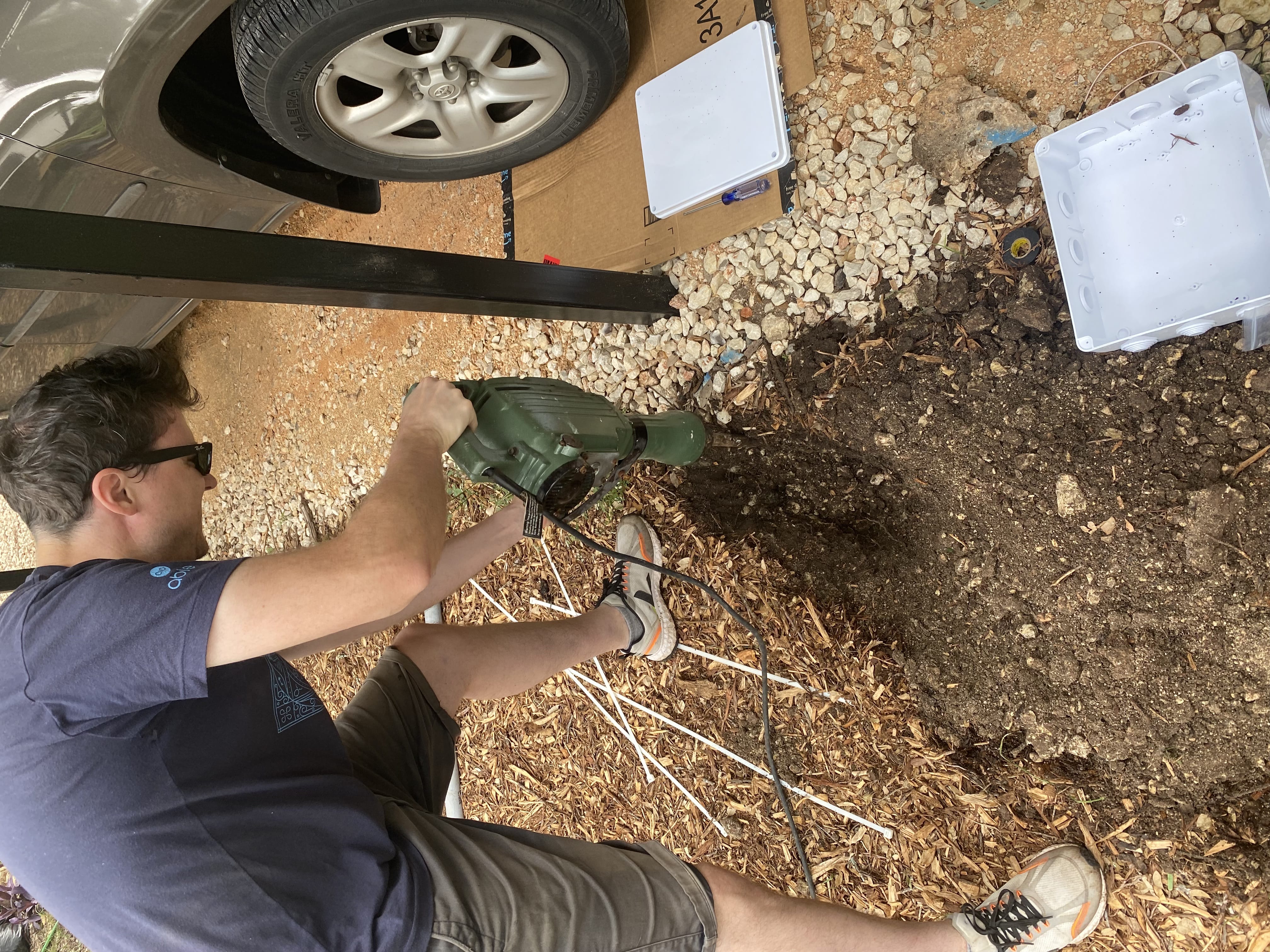 A guy digging with a jackhammer